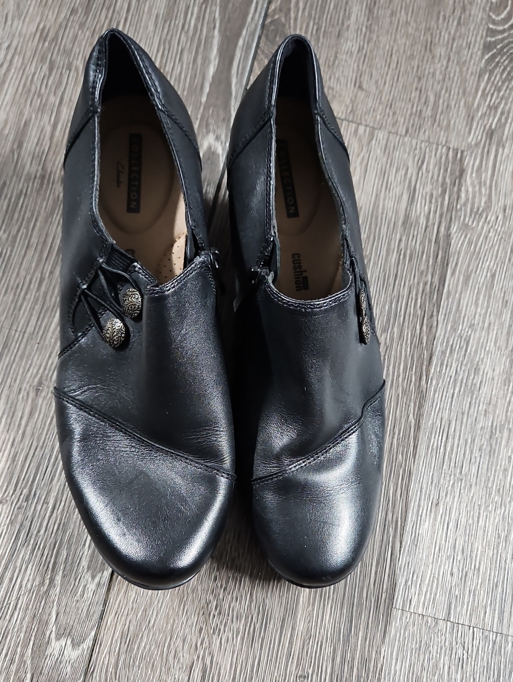 Clarks Black Leather Slip-On Loafers with Decorative Buttons